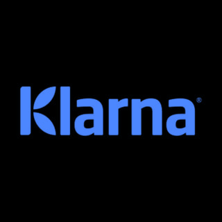 DoomBench-blue rendering of the Klarna logo against a black background.