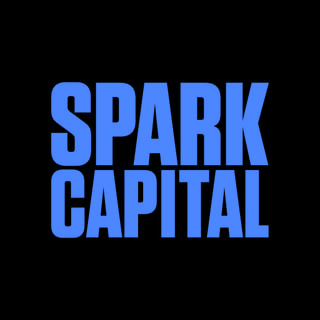 DoomBench-blue rendering of the Spark Capital logo against a black background.