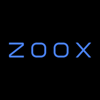 DoomBench-blue rendering of the Zoox logo against a black background.