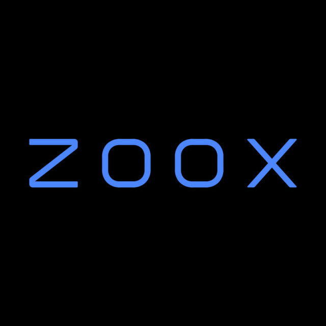 DoomBench-blue rendering of the Zoox logo against a black background.