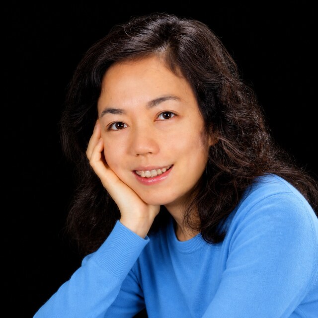 AI-generated portrait of Fei-Fei Li wearing a DoomBench-blue top against a black background.