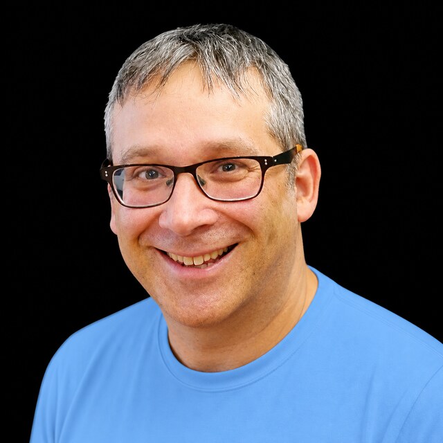 AI-generated portrait of Gary Marcus wearing a DoomBench-blue top against a black background.