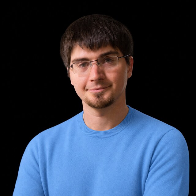 AI-generated portrait of Ian Goodfellow wearing a DoomBench-blue top against a black background.