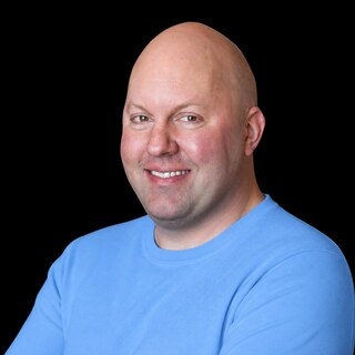 AI-generated portrait of Marc Andreessen wearing a DoomBench-blue top against a black background.