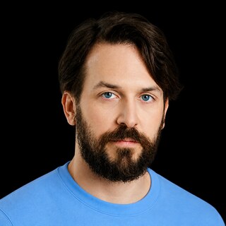 AI-generated portrait of Nate Soares wearing a DoomBench-blue top against a black background.