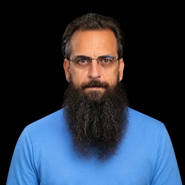 AI-generated portrait of Roman Yampolskiy wearing a DoomBench-blue top against a black background.