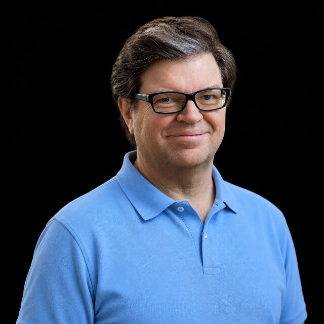 AI-generated portrait of Yann LeCun wearing a DoomBench-blue top against a black background.