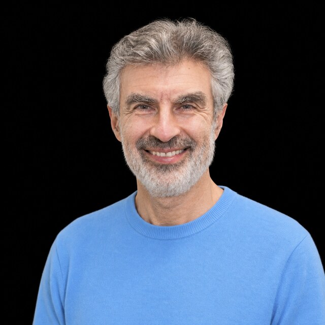 AI-generated portrait of Yoshua Bengio wearing a DoomBench-blue top against a black background.